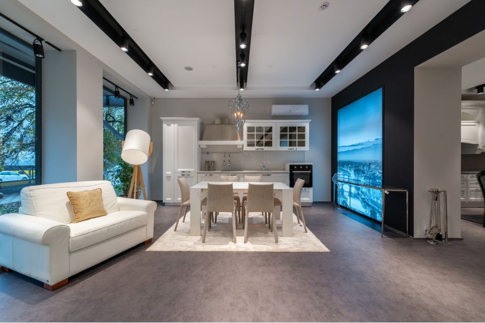 quite condo rental Serene condo living space featuring a plush sofa, large windows, and minimalist décor for a tranquil retreat